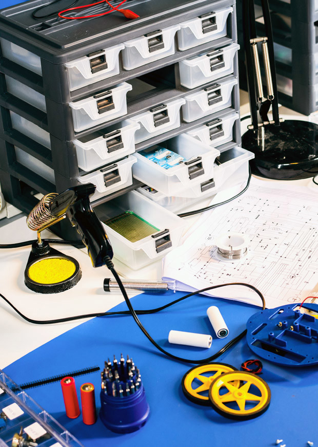 Workshop table with a variety of materials, portrait crop