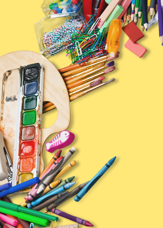 Various art materials on a yellow desk