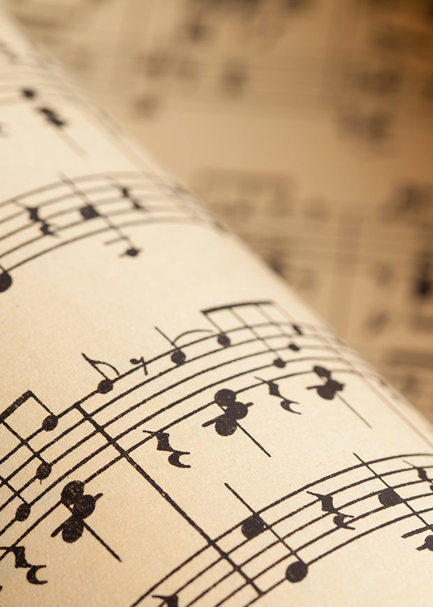 Portrait crop of rolls of sheet music