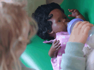 Child playing with a doll